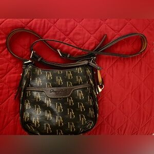 Dooney & Bourke Brown and Gold/Tan DB Logo Crossbody Bag With Adjustable Strap.